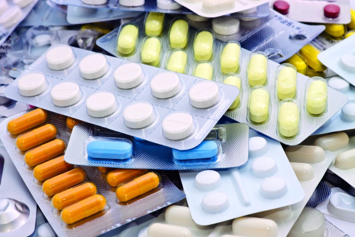 Assorted tablets and capsules in blister packs