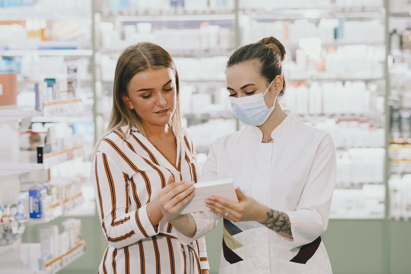 Pharmacist checking medicine in a pharmacy